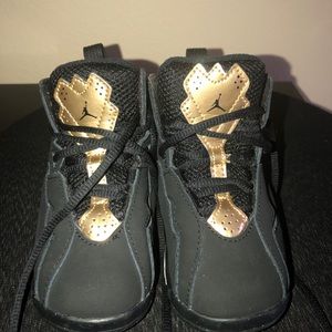 Black and gold size 7 Jordan’s